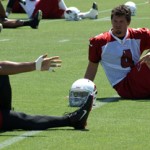 Larry Fitzgerald and Kevin Kolb stretch before 
OTAs Thursday. (Photo by Adam Green/Arizona 
Sports)
