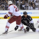 Los Angeles Kings defenseman Rob Scuderi, 
right, kicks the puck away from Phoenix Coyotes 
center Kyle Chipchura during the first period 
of Game 3 of the NHL hockey Stanley Cup Western 
Conference finals, Thursday, May 17, 2012, in 
Los Angeles. (AP Photo/Mark J. Terrill)
