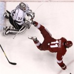 Los Angeles Kings' Jonathan Quick (32) trips up 
Phoenix Coyotes' Martin Hanzal (11), of the 
Czech Republic, in the first period during Game 
2 of the NHL hockey Stanley Cup Western 
Conference finals, Tuesday, May 15, 2012, in 
Glendale, Ariz. The Kings defeated the Coyotes 
4-0.(AP Photo/Ross D. Franklin)
