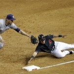 
Milwaukee Brewers' Corey Hart, left, tags out Arizona Diamondbacks' 
Gerardo Parra, who was caught off base during the second inning of a 
baseball game, Saturday, May 26, 2012, in Phoenix. (AP Photo/Matt 
York)
