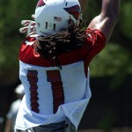 Receiver Larry Fitzgerald reaches to make a 
catch during OTAs Thursday, June 7. (Adam 
Green/Arizona Sports)