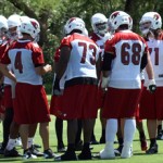 Kevin Kolb huddles with the team during 
minicamp Tuesday, June 12. (Craig 
Grialou/Arizona Sports)