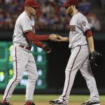 Arizona Diamondbacks manager Kirk Gibson, left, pulls the starting pitcher Ian Kennedy during the sixth inning of a baseball game against the Texas Rangers, Tuesday, June 12, 2012, in Arlington, Texas. (AP Photo/LM Otero)