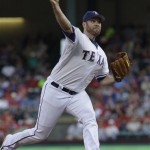 Texas Rangers starting pitcher Colby Lewis throws during the first inning of a baseball game against the Arizona Diamondbacks, Tuesday, June 12, 2012, in Arlington, Texas. (AP Photo/LM Otero)