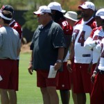 Russ Grimm and members of the offense wait 
during morning minicamp Wednesday, June 13. 
(Craig Grialou/Arizona Sports)