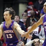 Phoenix Suns' Steve Nash (13) celebrates his 
game-winning shot with teammate Grant Hill (33) 
during the second half of an NBA basketball 
game against Milwaukee Bucks on Tuesday, Feb. 
7, 2012, in Milwaukee. The Suns won 107-105. 
(AP Photo/Jeffrey Phelps