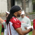 Wide receiver Larry Fitzgerald offers advice to rookie Gino Crump 
during Cardinals Training Camp in Flagstaff Wednesday. (Photo: 
Vince Marotta/Arizona Sports)