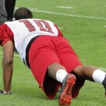 Wide receiver DeMarco Sampson drops for ten push-ups during 
Cardinals Training Camp in Flagstaff Wednesday. (Photo: Vince 
Marotta/Arizona Sports)