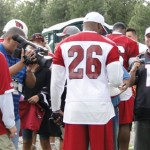 Injured running back Beanie Wells signs autographs for fans during 
Cardinals Training Camp in Flagstaff Wednesday. (Photo: Vince 
Marotta/Arizona Sports)