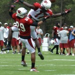 LaRon Byrd goes up for the pass while Jamell 
Fleming defends at Cardinals training camp 
Saturday, July 28. (Adam Green/Arizona Sports)