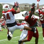 Rob Housler has the pass broken up before he 
could make the catch at Cardinals training camp 
Saturday, July 28. (Adam Green/Arizona Sports)