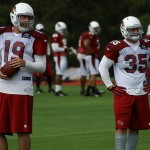 John Skelton and Anthony Sherman wait for the next play during 
training camp in Flagstaff on July 31, 2012. (Adam Green/Arizona 
Sports)