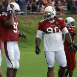 Darnell Dockett and Calais Campbell chat during training camp in 
Flagstaff on July 31, 2012. (Adam Green/Arizona Sports)