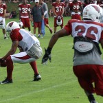 Michael Floyd reaches down to make the catch during training camp in 
Flagstaff on July 31, 2012. (Adam Green/Arizona Sports)