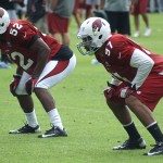 Colin Parker and Quan Sturdivant wait for the play during training 
camp in Flagstaff on July 31, 2012. (Adam Green/Arizona Sports)
