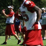 Kevin Kolb takes the snap during the team's morning walk-through at 
training camp August 1. (Adam Green/Arizona Sports)