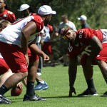 Darnell Dockett squares off against Bobby Massie during the team's 
morning walk-through at training camp August 1. (Adam 
Green/Arizona Sports)