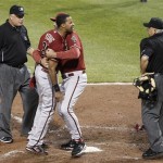 Arizona Diamondbacks' Chris Young, center left, is restrained by manager Kirk Gibson, center right, as he argues with home plate umpire Larry Vanover, right, after being ejected for arguing a called third strike for the last out in the of the top of the seventh inning of the baseball game against the Pittsburgh Pirates, Wednesday, Aug. 8, 2012, in Pittsburgh. First base umpire Alfonso Marquez is at left. The Pirates won 7-6. (AP Photo/Keith Srakocic)