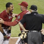 Arizona Diamondbacks' Chris Young, left, is restrained by manager Kirk Gibson as he argues with home plate umpire Larry Vanover, right, after being ejected for arguing a called third strike for the last out in the of the top of the seventh inning of the baseball game against the Pittsburgh Pirates on Wednesday, Aug. 8, 2012, in Pittsburgh. The Pirates won 7-6. (AP Photo/Keith Srakocic)