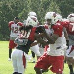 Defensive back Marshay Green (30) mixes it up with wide receiver Stephen Williams (right) during Cardinals training camp in Flagstaff Thursday, August 14. (Photo: Vince Marotta/Arizona Sports)
