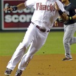 Arizona Diamondbacks' Chris Young heads for home to score on an RBI double by Aaron Hill during the first inning of a baseball game against the Miami Marlins, Tuesday, Aug. 21, 2012, in Phoenix. (AP Photo/Matt York)