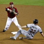 Miami Marlins' Donnie Murphy (22) is forced out at second as Arizona Diamondbacks' John McDonald throws to first for the out on Wade LeBlanc during the third inning of a baseball game, the second of a doubleheader, Wednesday, Aug. 22, 2012, in Phoenix. (AP Photo/Matt York)