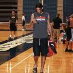 Suns forward Luis Scola checks his phone following Tuesday night's practice at training camp in San Diego. (Photo: Craig Grialou/Arizona Sports)