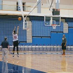 Markieff Morris getting up extra shots after practice as Suns president of basketball operations Lon Babby watches with player development coach Sean Rooks under the basket. (Photo: Craig Grialou/Arizona Sports)