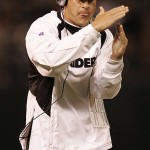 Oakland Raiders head coach Lane Kiffin calls for a time out as his team plays the Arizona Cardinals during the first half on an exhibition NFL football game in Oakland, Calif., Saturday. (AP Photo/Marcio Jose Sanchez)