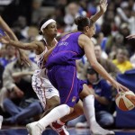 Phoenix Mercury guard Diana Taurasi, right, drives around Detroit Shock guard Deanna Nolan during the first quarter of the WNBA Finals at the Palace of Auburn Hills, Mich., Sunday, Sept. 16, 2007. (AP Photo/Carlos Osorio)