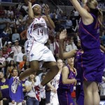 Detroit Shock guard Deanna Nolan (14) shoots over the defense of Phoenix Mercury forward Penny Taylor during the first quarter of the WNBA Finals at the Palace of Auburn Hills, Mich., Sunday, Sept. 16, 2007. (AP Photo/Carlos Osorio)