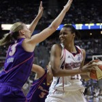 Detroit Shock forward Plenette Pierson (23) runs into the defense of Phoenix Mercury forward Penny Taylor during the first quarter of the WNBA Finals at the Palace of Auburn Hills, Mich., Sunday, Sept. 16, 2007. (AP Photo/Carlos Osorio)