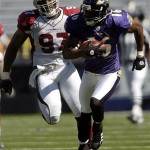 Baltimore Ravens return specialist Yamon Figurs runs past Calvin Pace of the Arizona Cardinals during a punt return for a touchdown in the second quarter. AP Photo/Steve Ruark