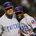Chicago Cubs manager Lou Piniella gives a hug to Alfonso Soriano during player introductions prior to their game against the Arizona Diamondbacks in Game 1. AP Photo/Ross D. Franklin