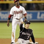 Arizona Diamondbacks' Justin Upton reacts after he was called for interference for taking out Colorado Rockies second baseman Kazuo Matsui during the seventh inning in Game 1 of the National League Championship baseball series in Phoenix, Thursday. (AP Photo/Matt York)