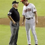 Arizona Diamondbacks manager Bob Melvin, right, argues with umpire Larry Vanover after Diamondbacks' Justin Upton was called for interference for taking out Colorado Rockies second baseman Kazuo Matsui during the seventh inning in Game 1 of the National League Championship baseball series in Phoenix, Thursday. (AP Photo/Eric Gay)