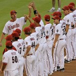 Arizona Diamondbacks pitcher Randy Johnson high fives teammates as he is introduced before Game 1 of the National League Championship baseball series against the Colorado Rockies in Phoenix, Thursday. (AP Photo/Ross D. Franklin)