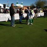 Chambers observes a young putter's form at the R.S. Hoyt Jr. Family Foundation Dream Day at TPC Scottsdale Tuesday, January 29, 2013. (Photo: Kyndra de St. Aubin/Arizona Sports)