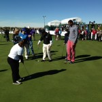 Frye watches as a young man sets up to putt at the R.S. Hoyt Jr. Family Foundation Dream Day at TPC Scottsdale Tuesday, January 29, 2013. (Photo: Kyndra de St. Aubin/Arizona Sports)