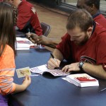 Diamondbacks outfielder Jason Kubel signs an autograph for a young fan. (Photo by Adam Green/Arizona Sports)