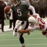 Philadelphia Eagles quarterback Donovan McNabb (5) pushes Arizona Cardinals' Pat Tillman away as he rushes for a touchdown in the third quarter Sunday, Nov. 19, 2000, in Philadelphia. The Eagles won 34-9. (AP Photo/Rusty Kennedy)