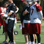 Carson Palmer and Jeff King watch during voluntary veterans mini-camp at the team's Tempe training facility on April 23, 2013. (Adam Green/Arizona Sports)