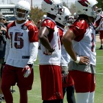From left, receivers Michael Floyd, LaRon Byrd and Larry Fitzgerald prepare to run through a drill during Arizona Cardinals OTAs on Tuesday, May 14 at the team's Tempe training facility. (Adam Green/Arizona Sports)