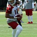 Receiver Larry Fitzgerald turns after making a catch during Arizona Cardinals OTAs on Tuesday, May 14 at the team's Tempe training facility. (Adam Green/Arizona Sports)