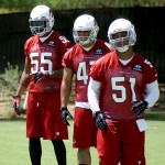 From back to front, linebackers Karlos Dansby, Korey Jones and Kevin Minter wait to run through a drill during Arizona Cardinals OTAs on Tuesday, May 14 at the team's Tempe training facility. (Adam Green/Arizona Sports)