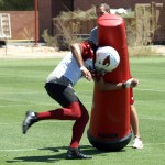 Receiver Larry Fitzgerald runs through a drill during OTAs on May 21, 2013 at the team's Tempe training facility. (Adam Green/Arizona Sports)