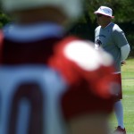 Head coach Bruce Arians watches during OTAs on May 21, 2013 at the team's Tempe training facility. (Adam Green/Arizona Sports)