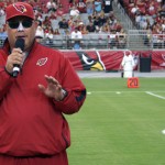 Head coach Bruce Arians speaks to the crowd during Arizona Cardinals Fan Fest at University of Phoenix Stadium on June 11, 2013. (Adam Green/Arizona Sports)