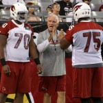 Assistant offensive line coach Larry Zierlein instructs Bobby Massie (70) and Levi Brown (75) during Arizona Cardinals Fan Fest at University of Phoenix Stadium on June 11, 2013. (Adam Green/Arizona Sports)