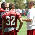 Patrick Peterson (left) and Tyrann Mathieu chat with strength and conditioning coach John Lott during minicamp on Wednesday, June 12, at the team's Tempe training facility. (Adam Green/Arizona Sports)